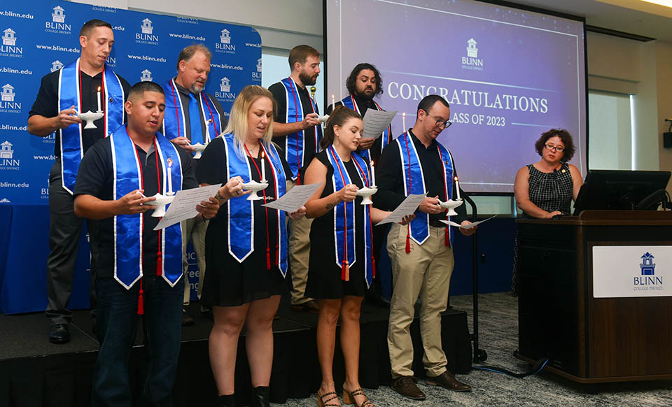 Eight nursing graduates are recognized in a ceremony at Texas A&M-RELLIS